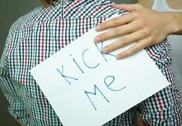 Guy with kick-me sign