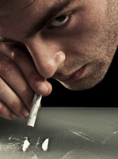 Man snorting cocaine