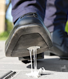 Gum stuck to a man's shoe