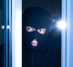 Burglar breaking in